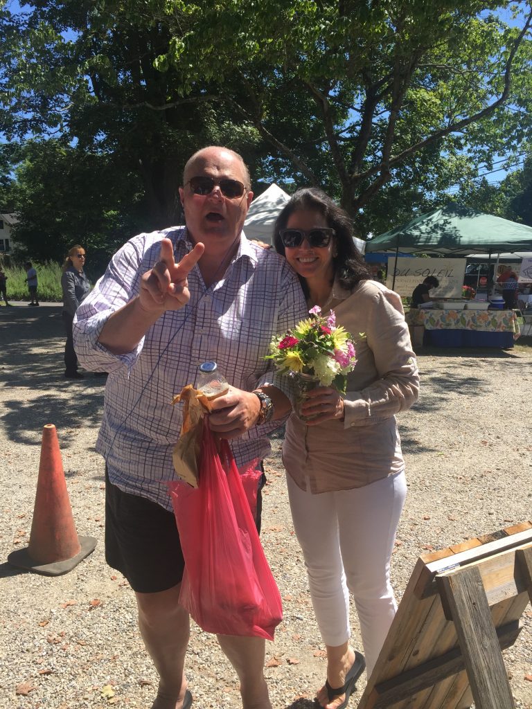 Sales Executive, Ben Halladay, and Publisher, Yvonne DeFrancesco, enjoy organic flowers and local baked bread. 